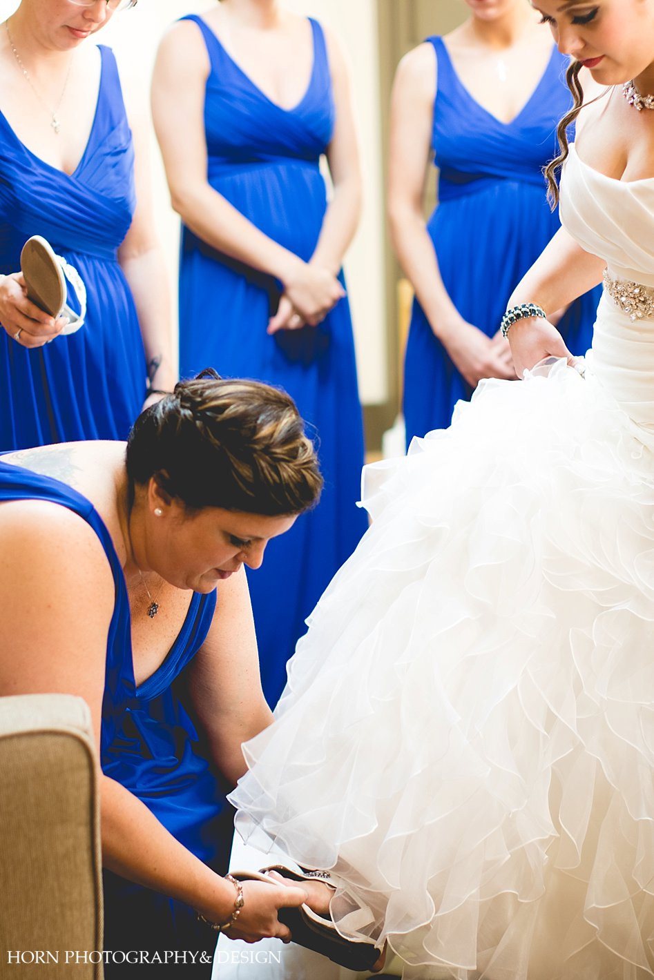 Bride getting ready photos with blue bridesmaids dresses