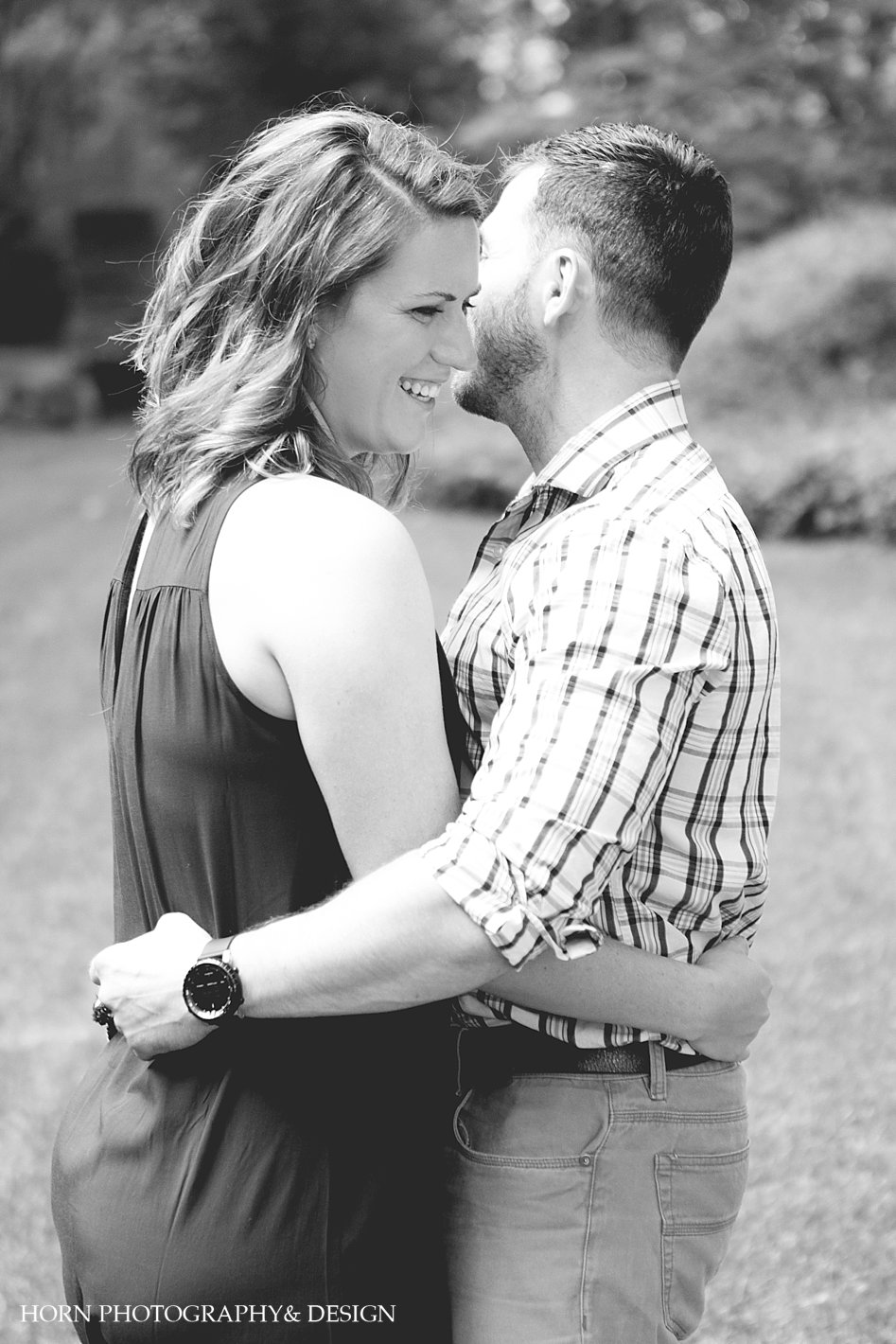 engagement shoot couple embracing in black and white