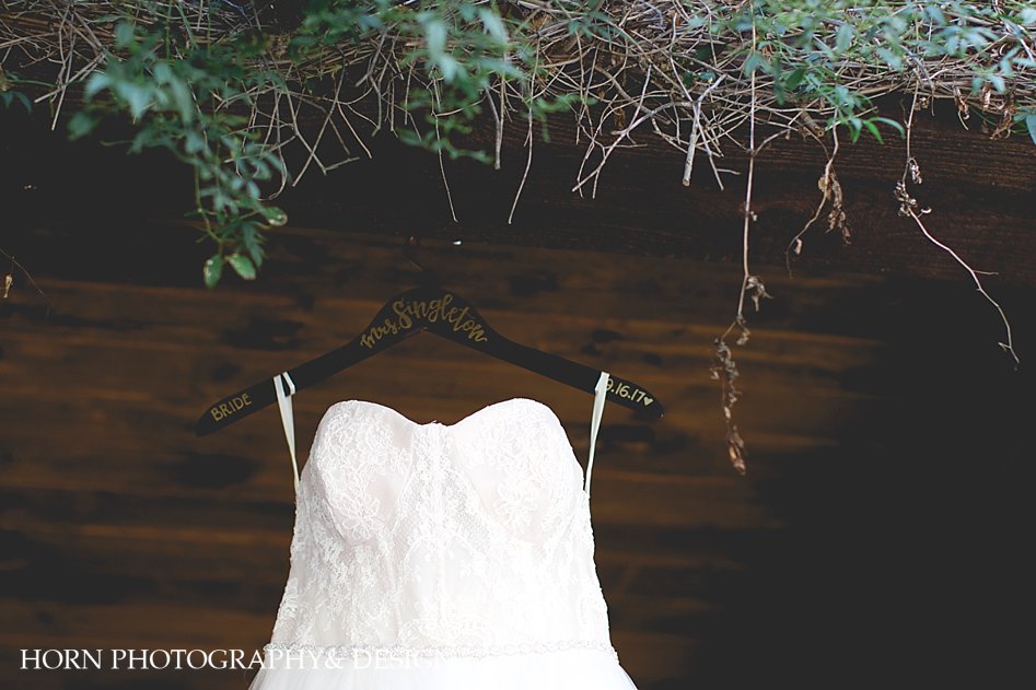 Custom Hanger, Bridal Gown, Wedding Dress hanging from vineyard North Georgia Mountains