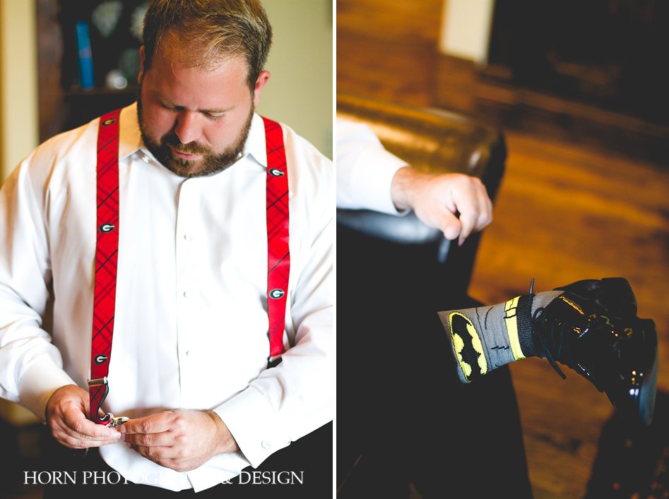 Groom getting ready, custom batman socks, UGA suspenders, white tux, montaluce winery