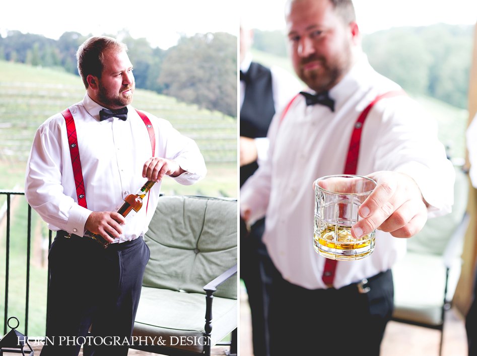groom having a pre wedding drink with groomsmen vineyard wedding