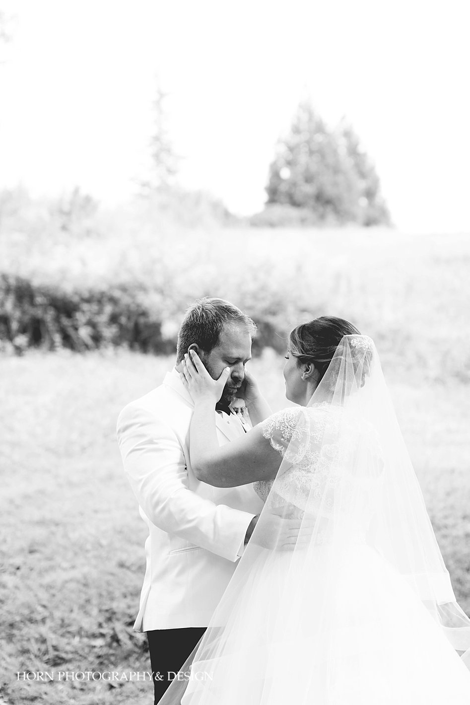 bride sees groom and wipes his tears black and white photography by horn photography and design