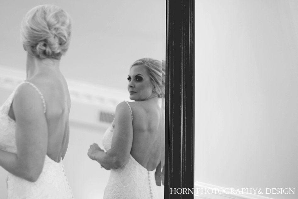 Blonde Bride looking in mirror open back dress country club wedding Gainesville Ga, Horn Photography and Design
