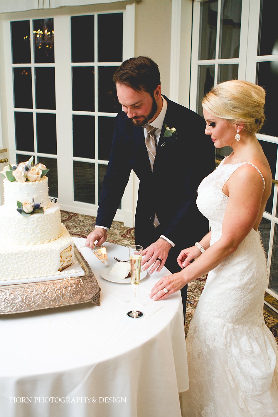 bride and groom cut the cake Chattahoochee Country Club Wedding Horn Photography and Design