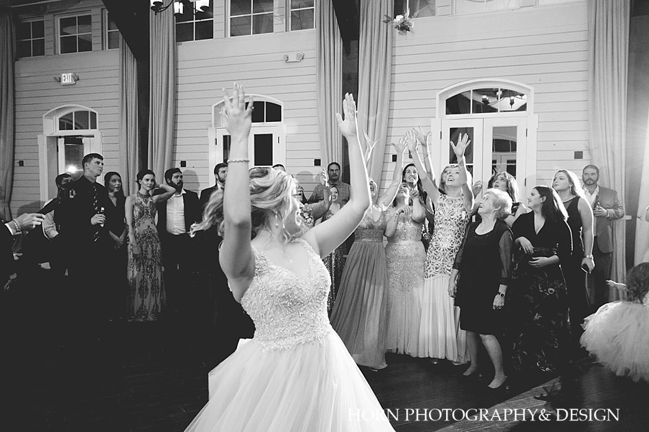 bouquet toss Foxhall Resort Wedding horn photography and design husband and wife team