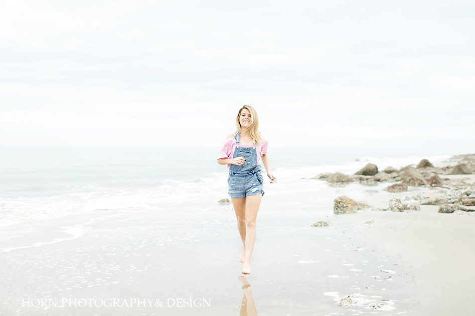 Driftwood Beach Senior Shoot girl on sand Horn Photography and Design