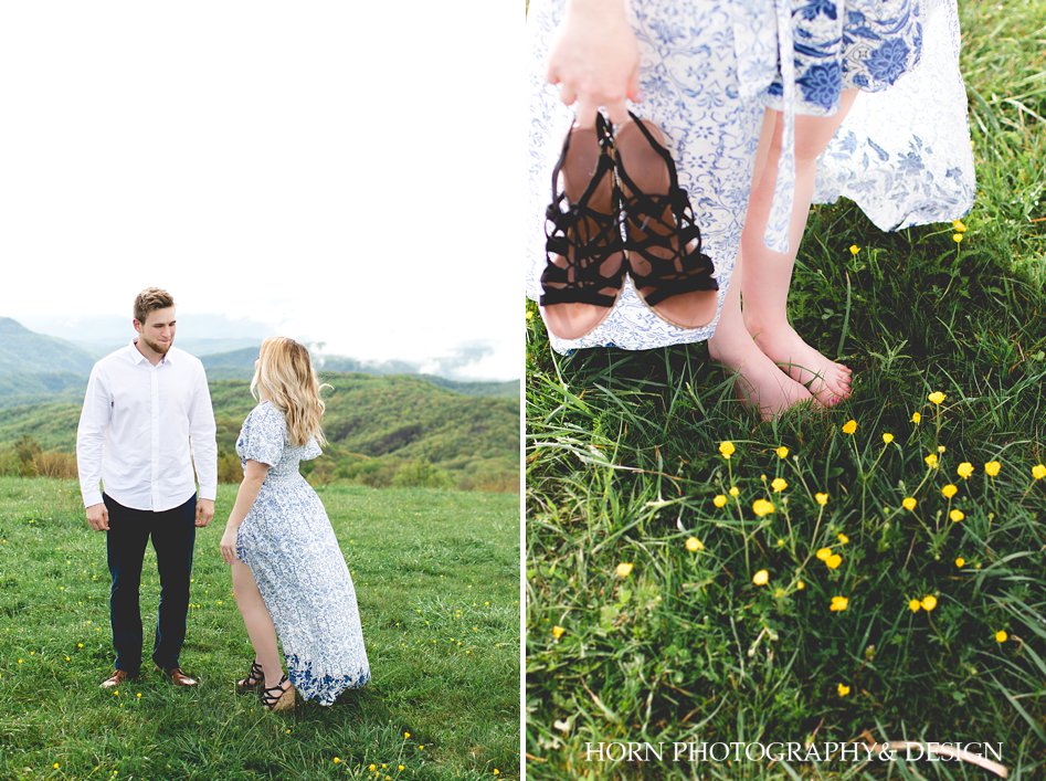 couple on top of a mountain adventurous engagement