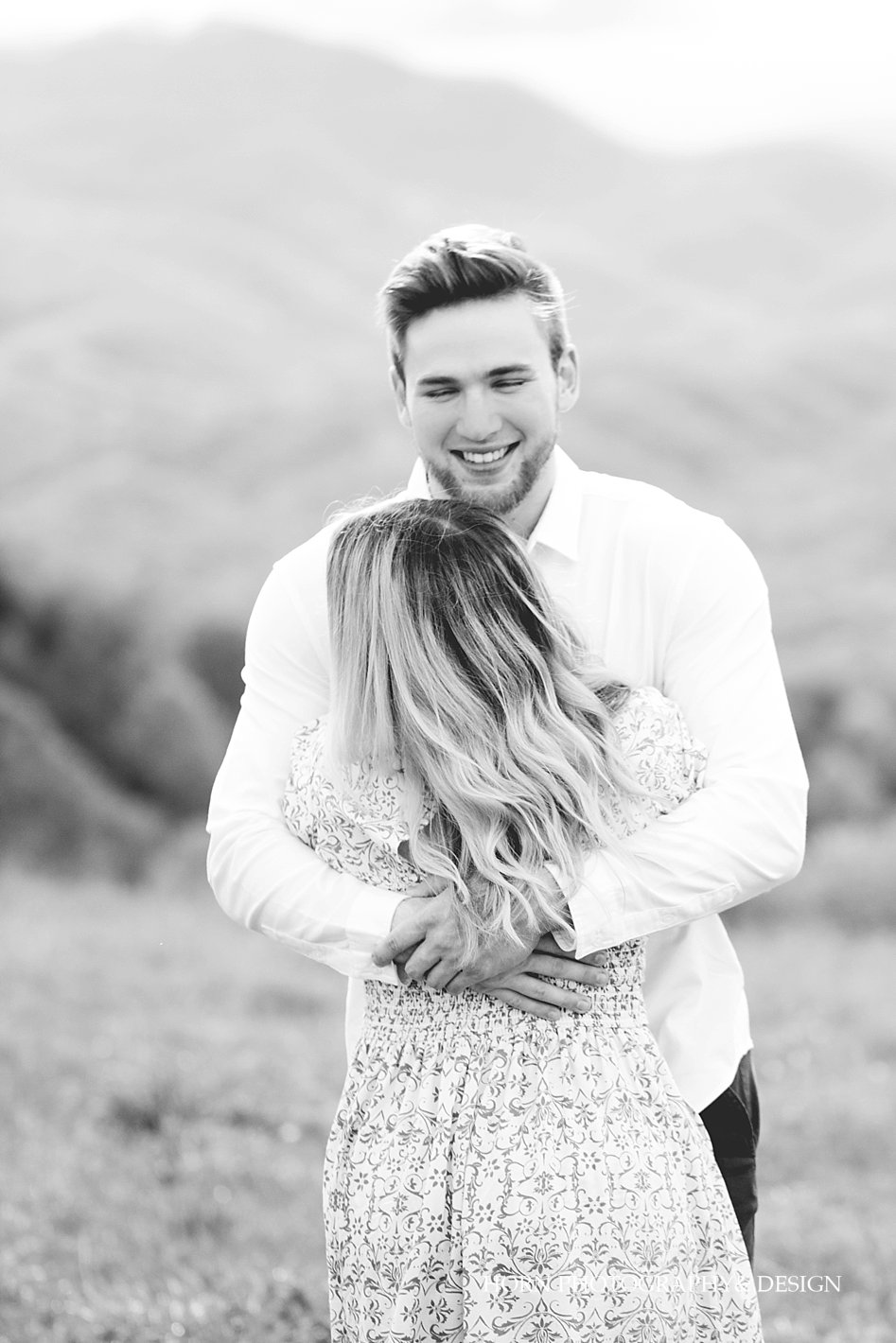 groom holds bride Max Patch Engagement Shoot horn photography and design Dahlonega 
