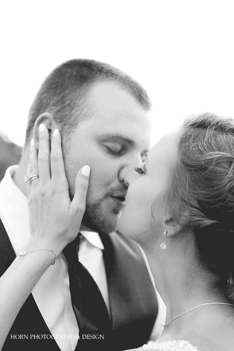 Black and white bride and groom kiss Vineyard Wedding Dahlonega