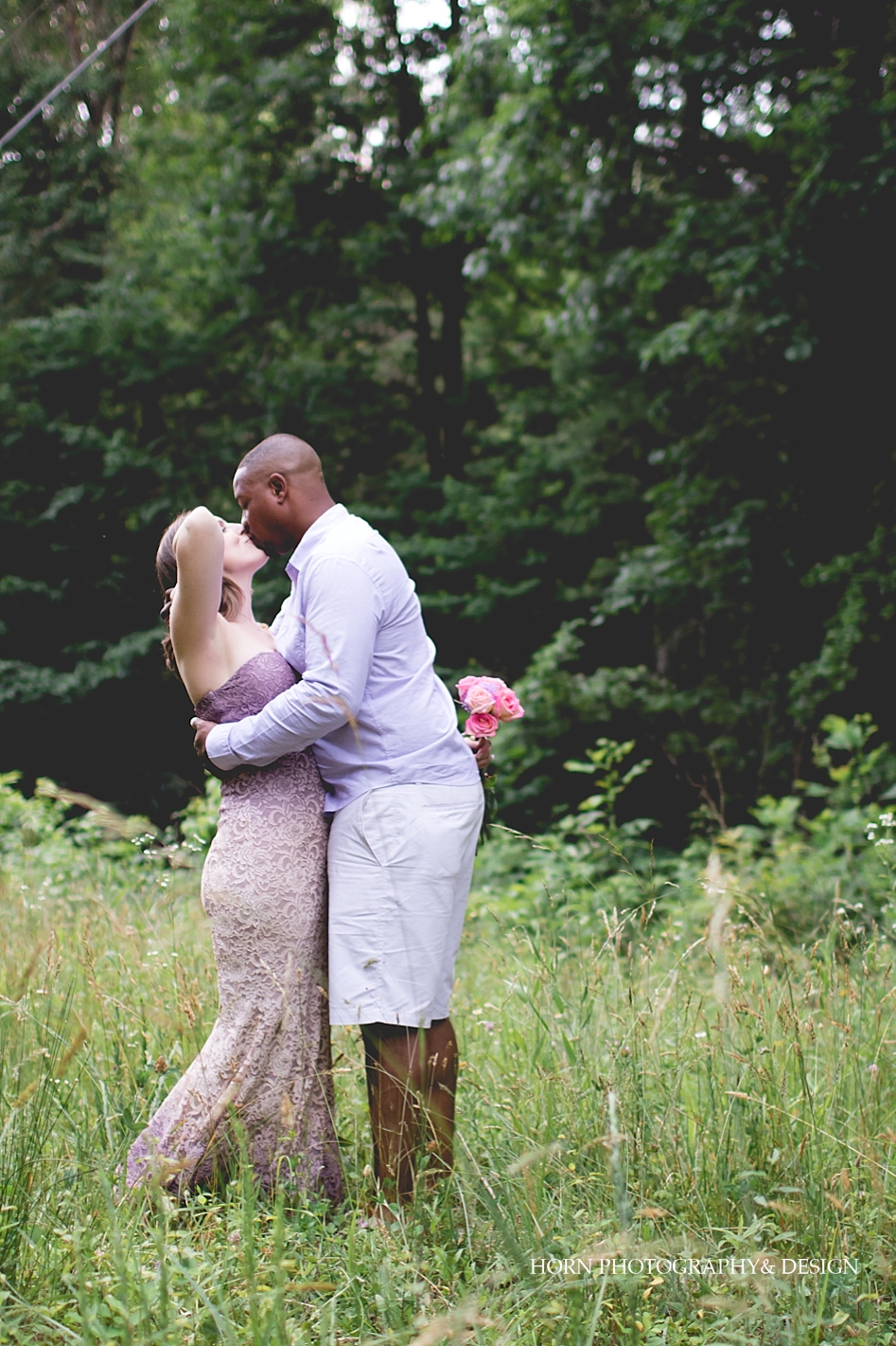 Dahlonega Engagement Guy kisses girl in field
