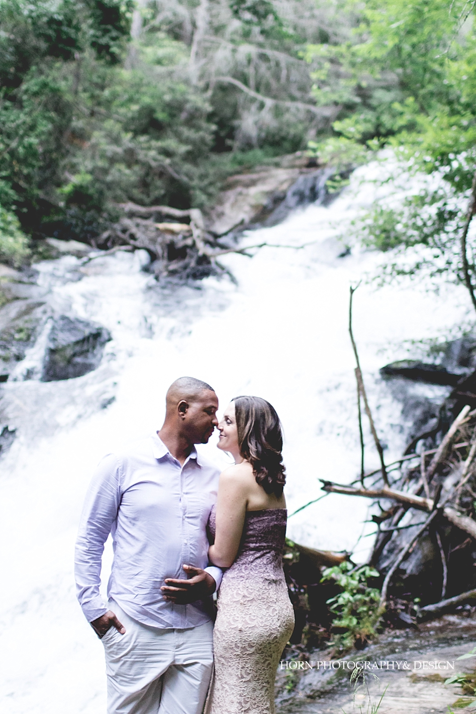 Dahlonega Engagement Waterfalls couple snuggles