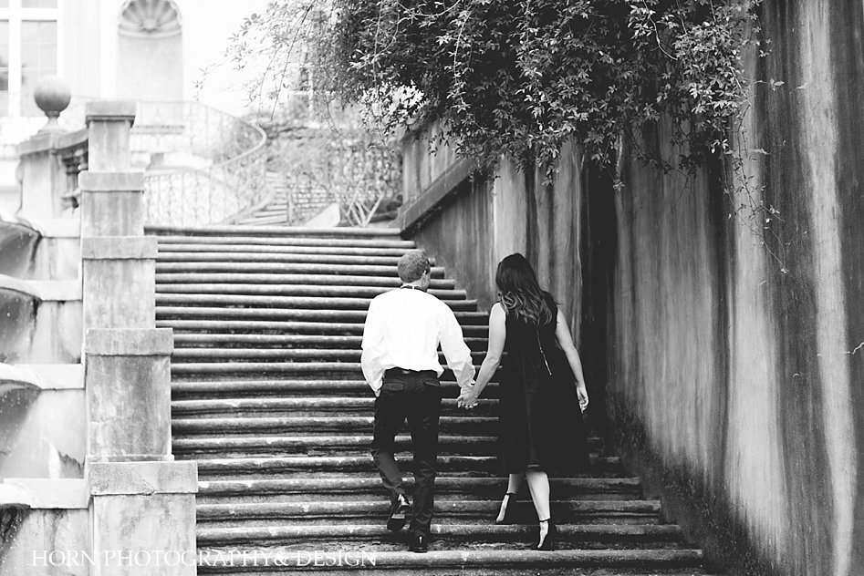 couple walks up stairs at swan house Atlanta Georgia wedding photographers 