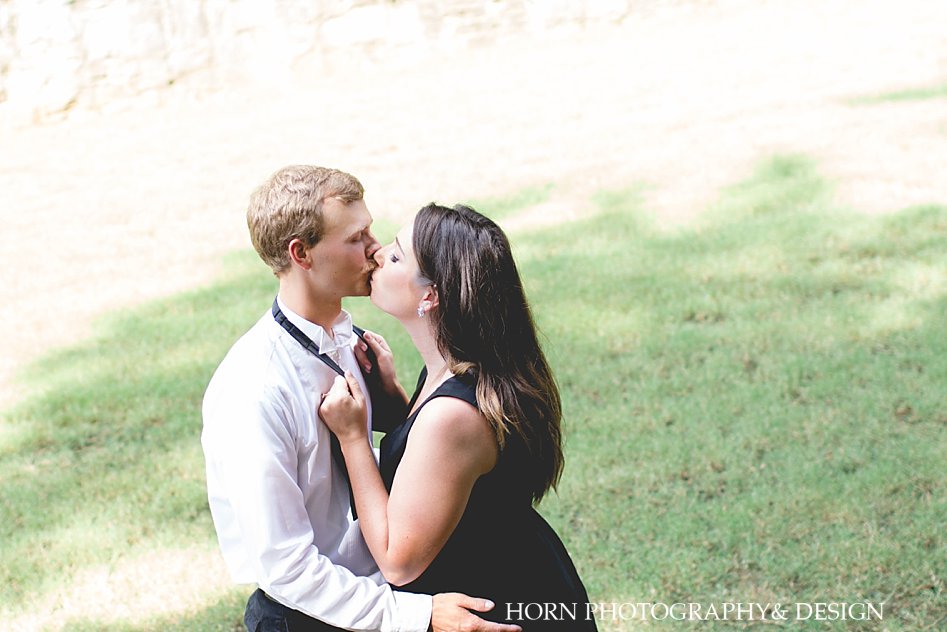 guy and girl kiss engagement shoot