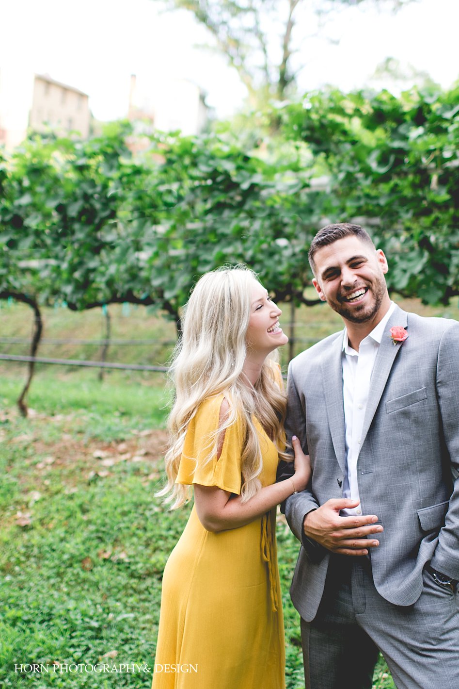 couple laughs as they hold one another Georgia Engagement Shoot