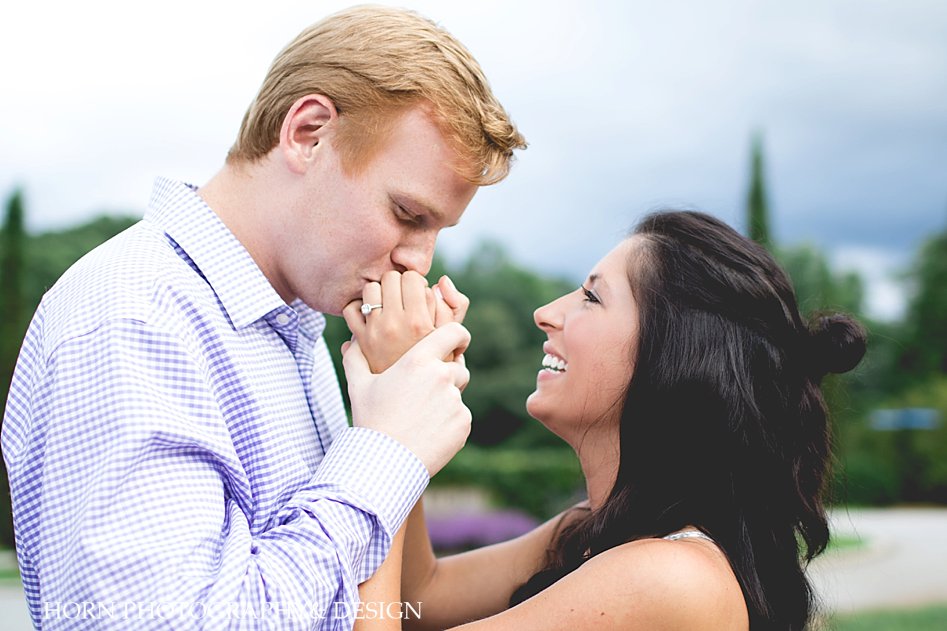 couple kisses on engagement shoot