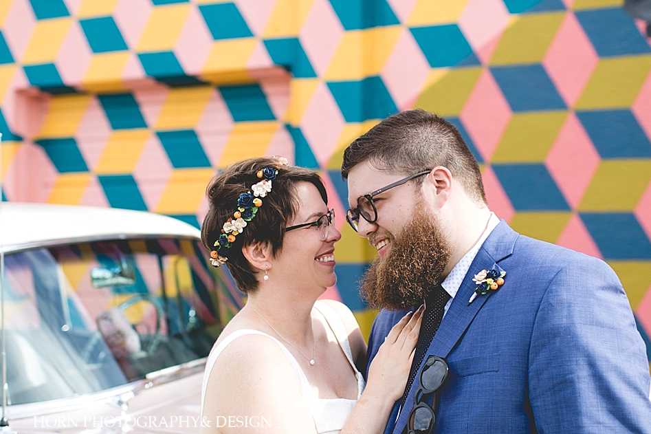 large beard wedding blue suit flower crown hipster