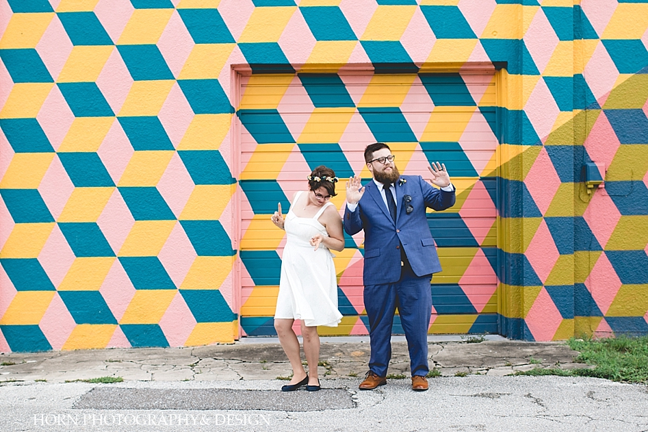 wedding couple dances in front of wall mural St. Petersburg Florida Wedding