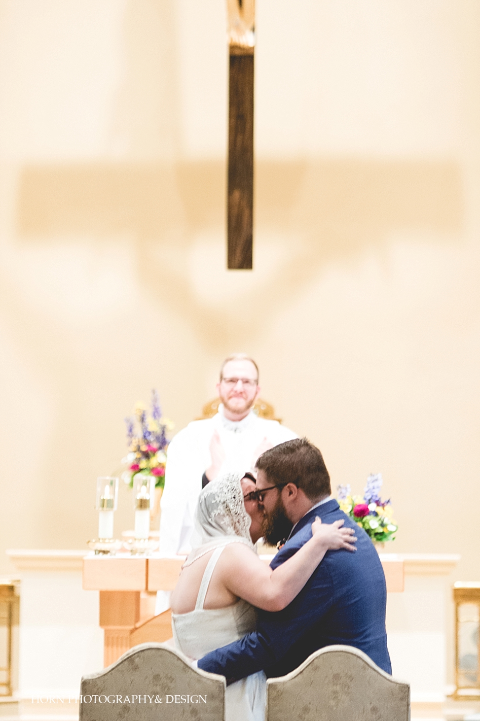 first kiss at catholic wedding horn photography and design catholic photographers