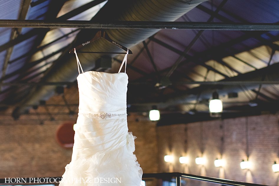 Bridal gown hung from ceiling