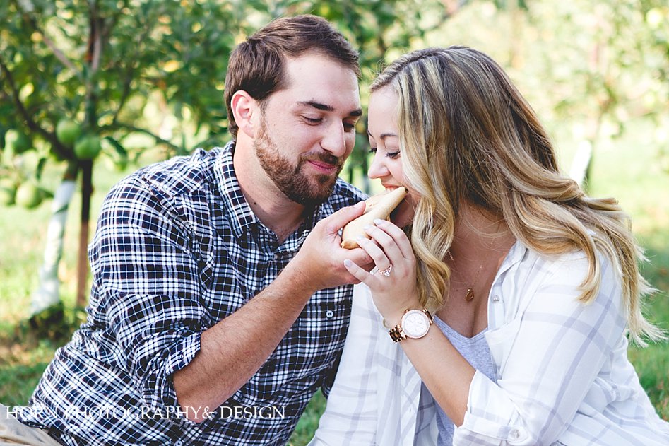 cute couple shares a warm apple pie, Engagement shoot Horn photography and Design Husband and Wife Photographer Team