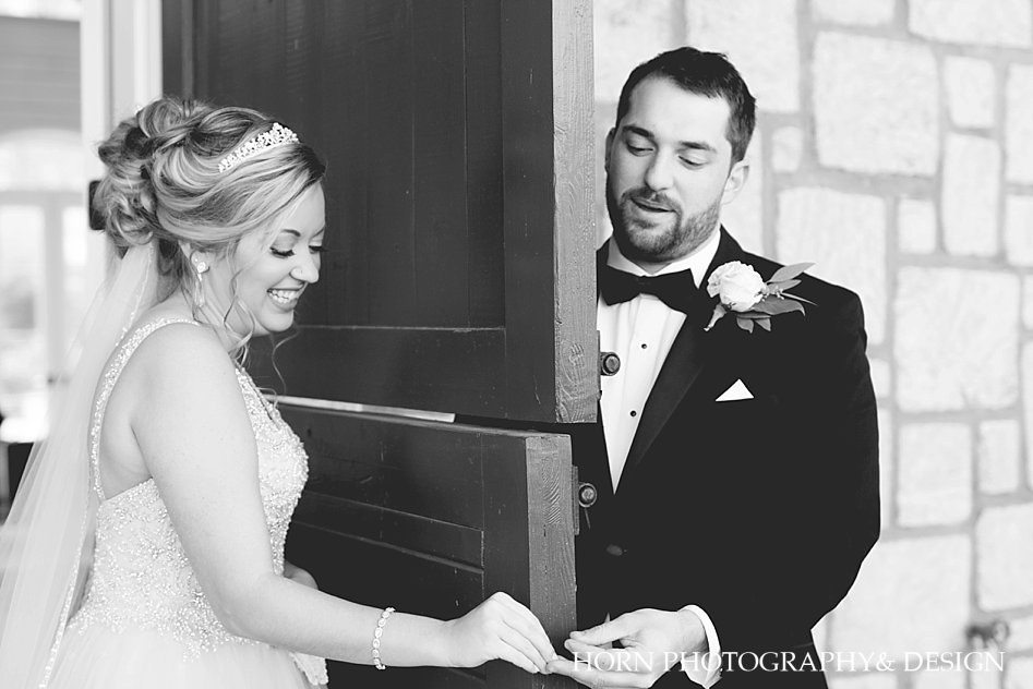 wedding couple share a first touch no peeking chimping horn photography and design