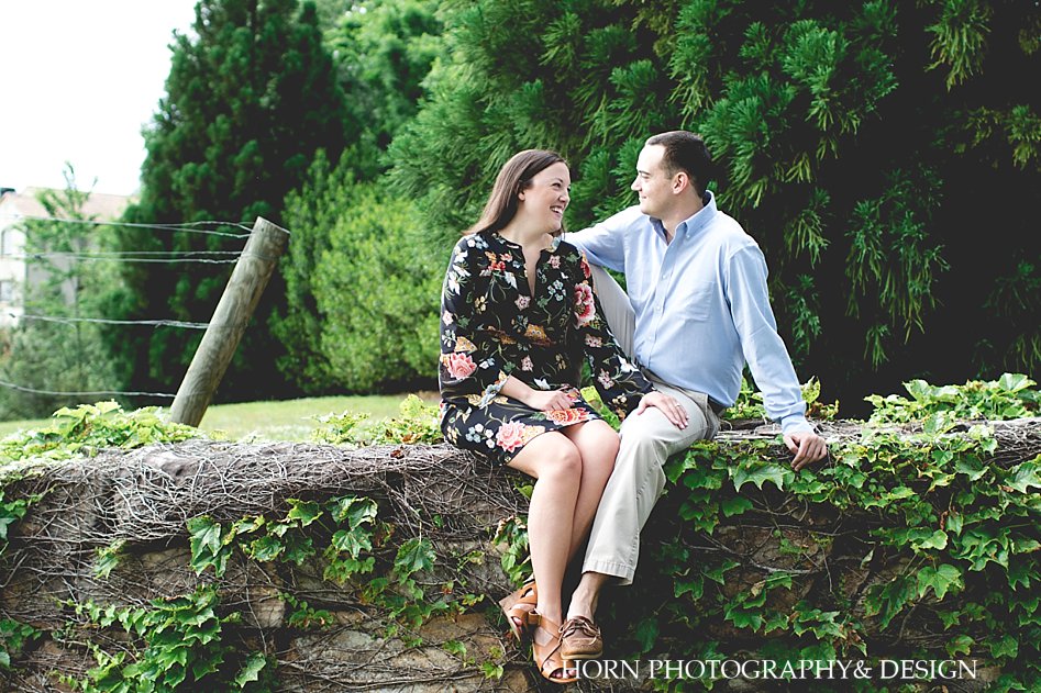 couple poses at North Georgia winery and vineyard engagement photos in Dahlonega Georgia by Horn Photography and Design