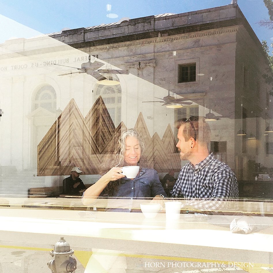couple in window drinking coffee gainesville photographers