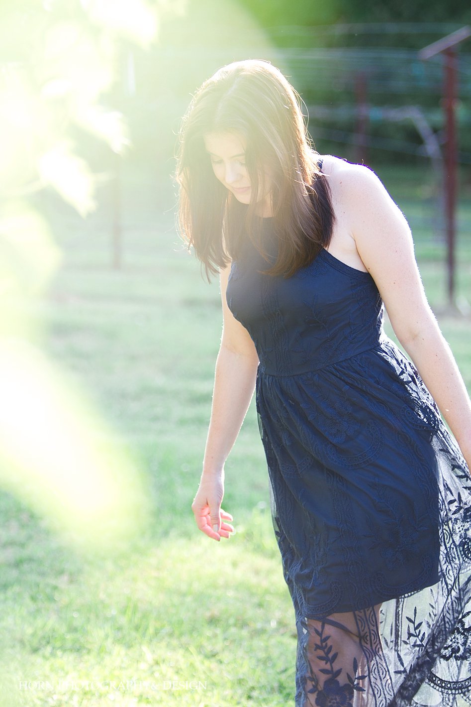 girl with navy blue sheer dress in vineyard 