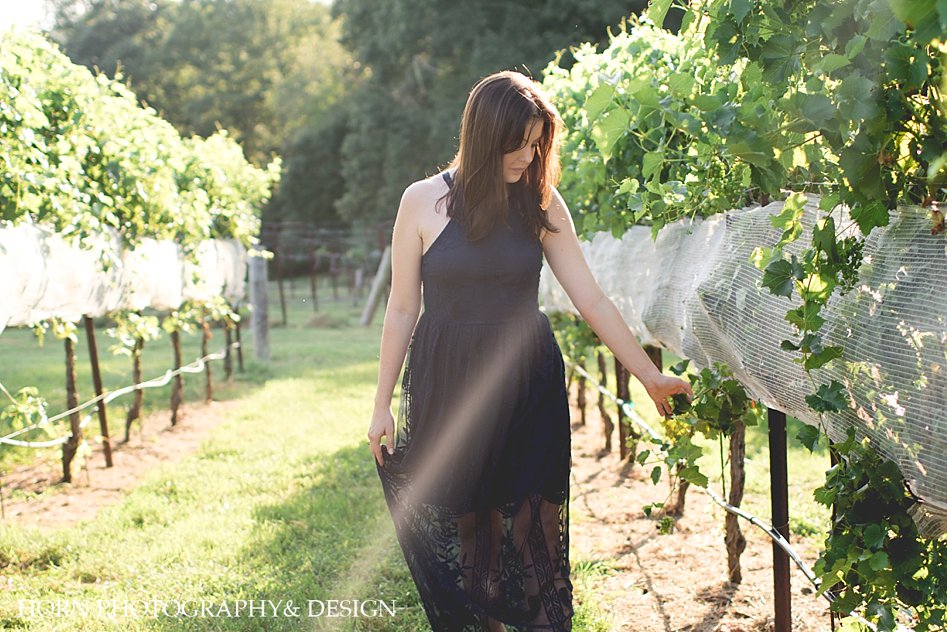 girl walks through vineyard North Georgia 