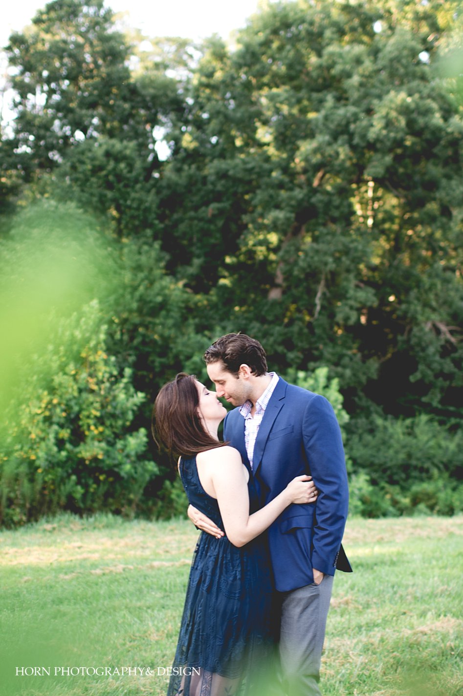 guy and girl hold one another in Dahlonega Georgia horn photography and design wedding photographers 
