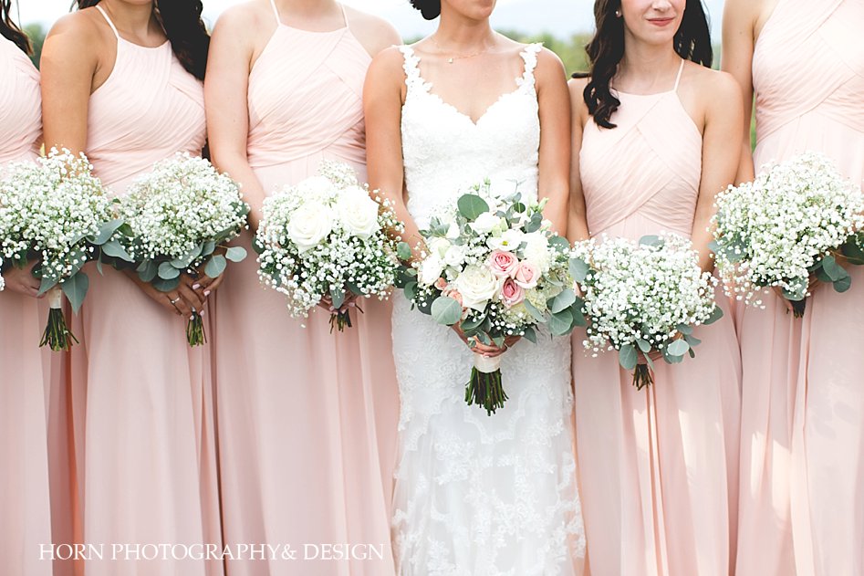 soft pink bridesmaids dresses baby's breath bouquets