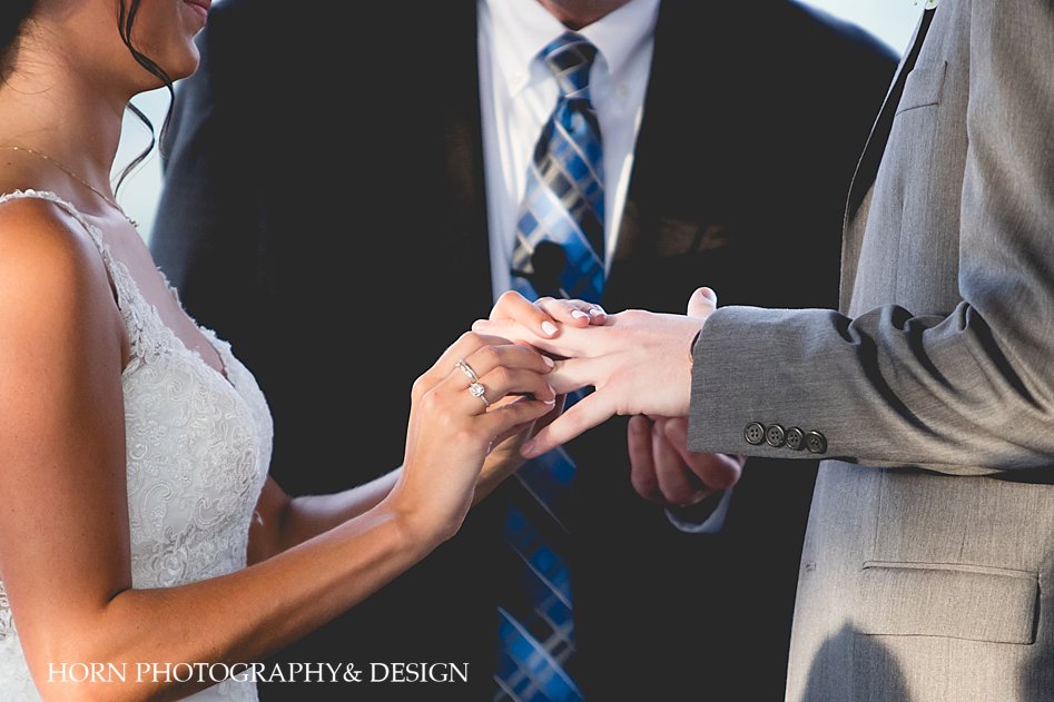 bride and groom exchanging rings