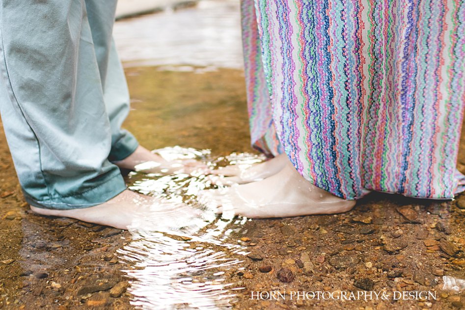 waterfall engagement session toes in water