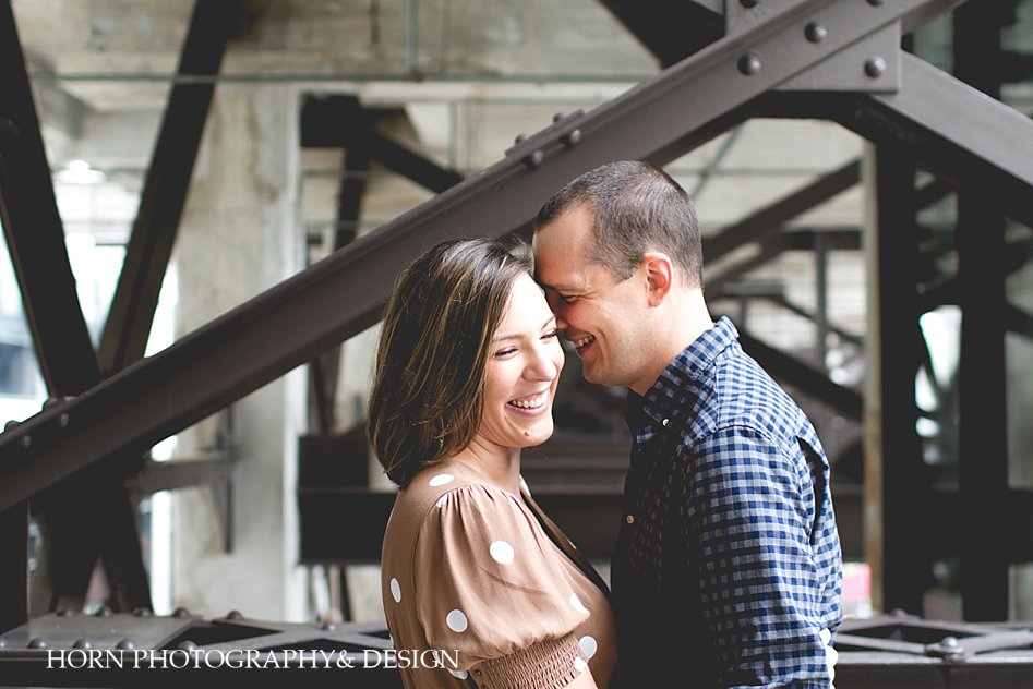 couple laughs and closes in Ponce City Market Engagement Session Horn Photography and Design