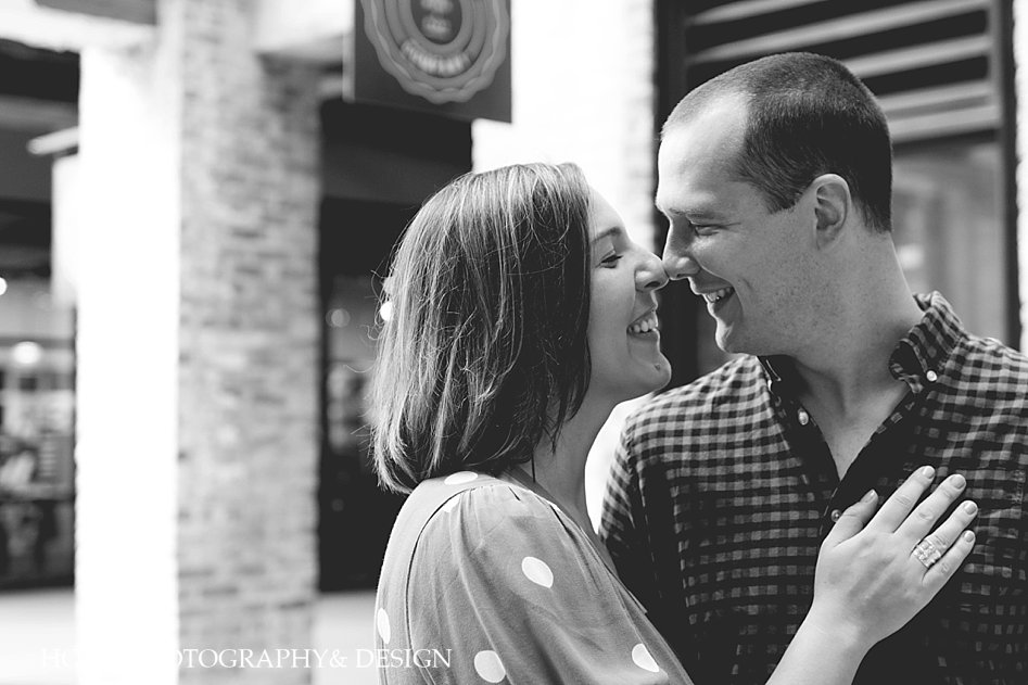 Black and white couple embraces at Ponce City Market Engagement Session Horn Photography and Design