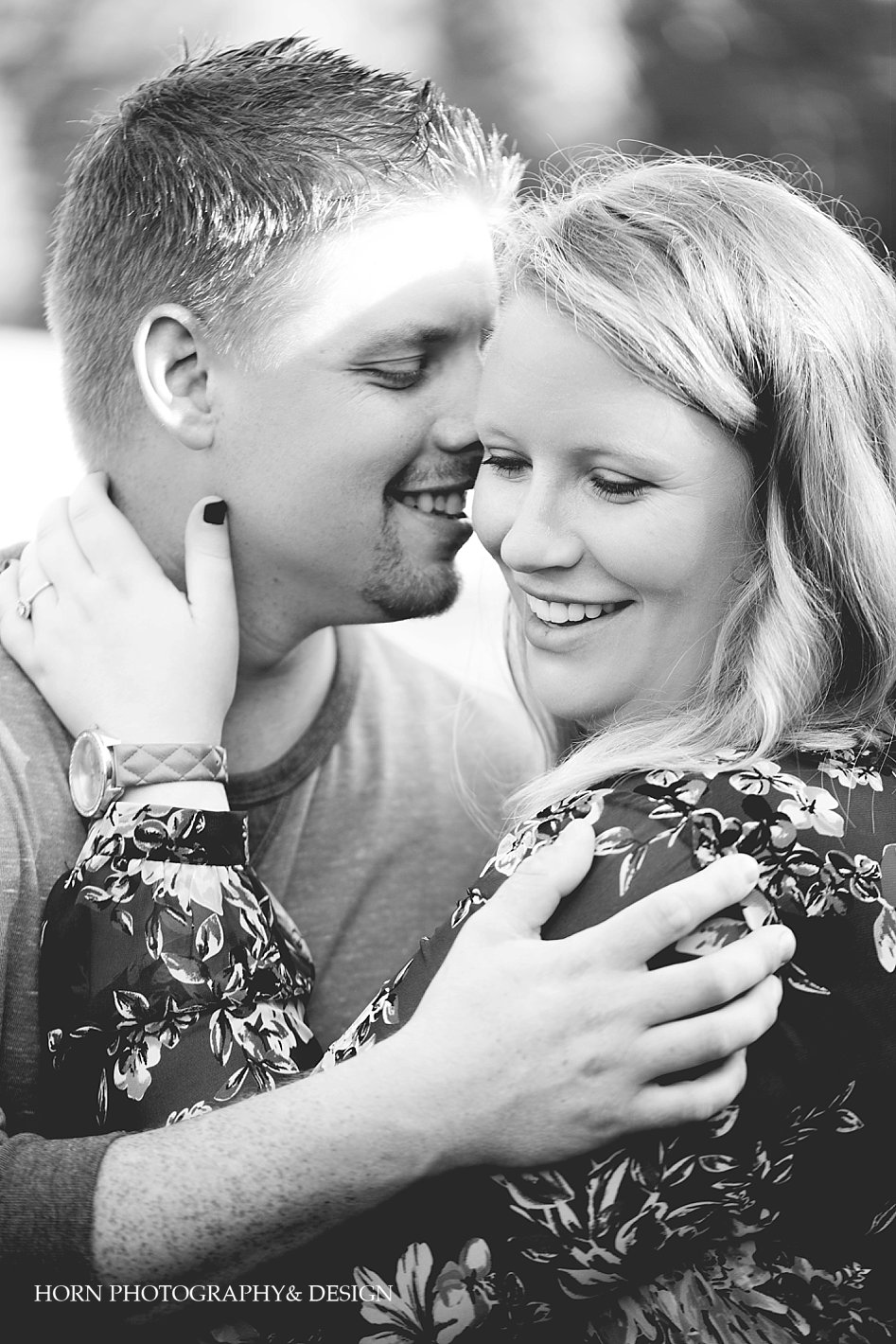 black and white couple embrace engagement session