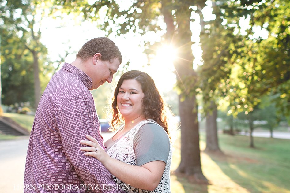 bright sunny photography couple holds one another 