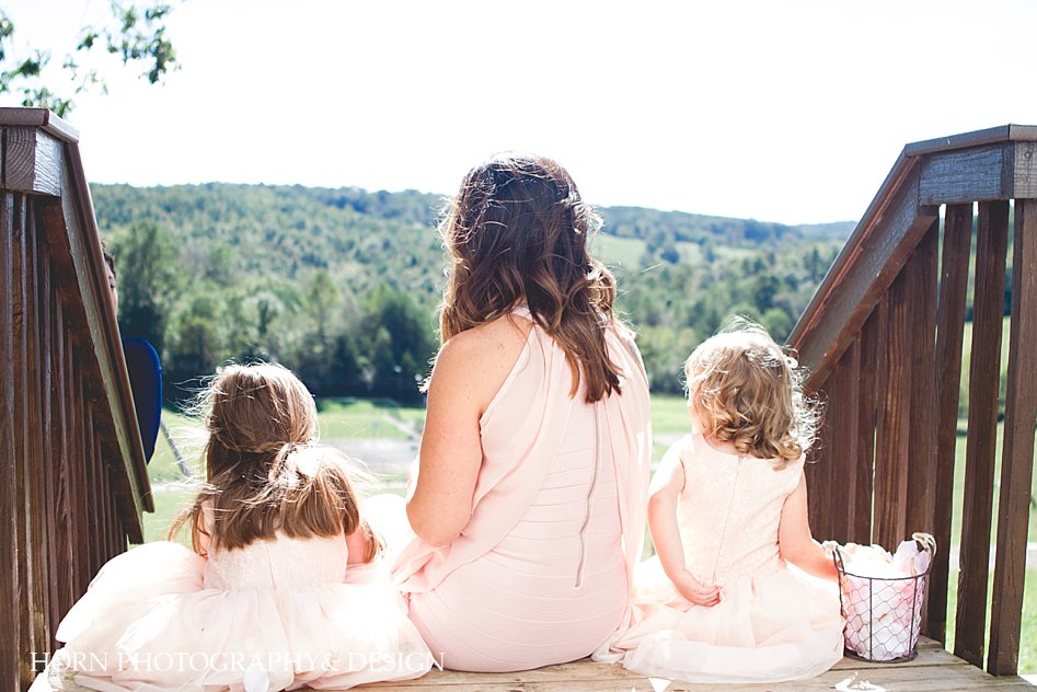 20 Year Vow Renwal R- Ranch Dahlonega bride sits with flower girls Horn Photography and design