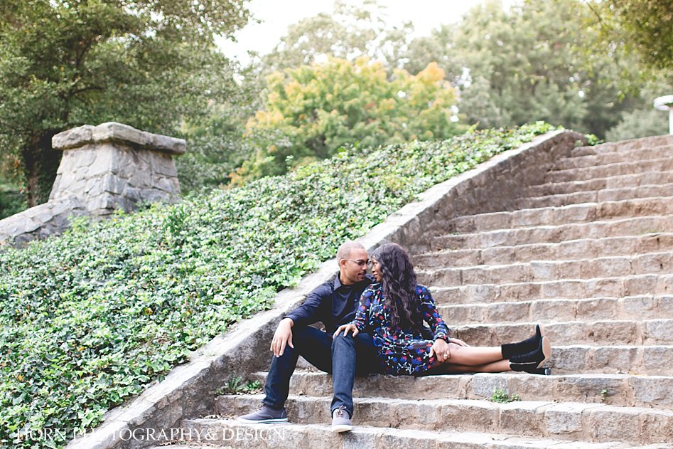 black couple sits on stairs in Piedmont park ATLANTA GEORGIA ATL anniversary shoot