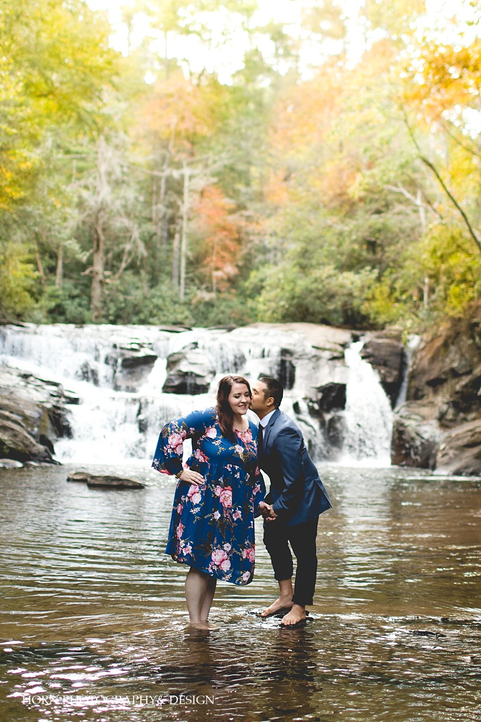 Fall Engagement Session Couple kisses in front of waterfall