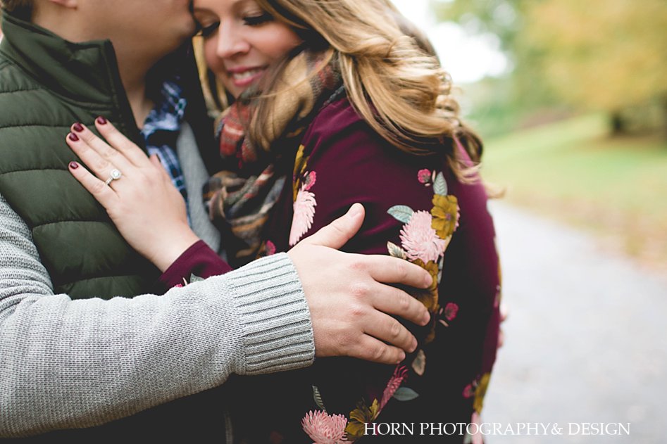 couple snuggles together for North Georgia Fall Engagement Horn photography and design Dahlonega photographer