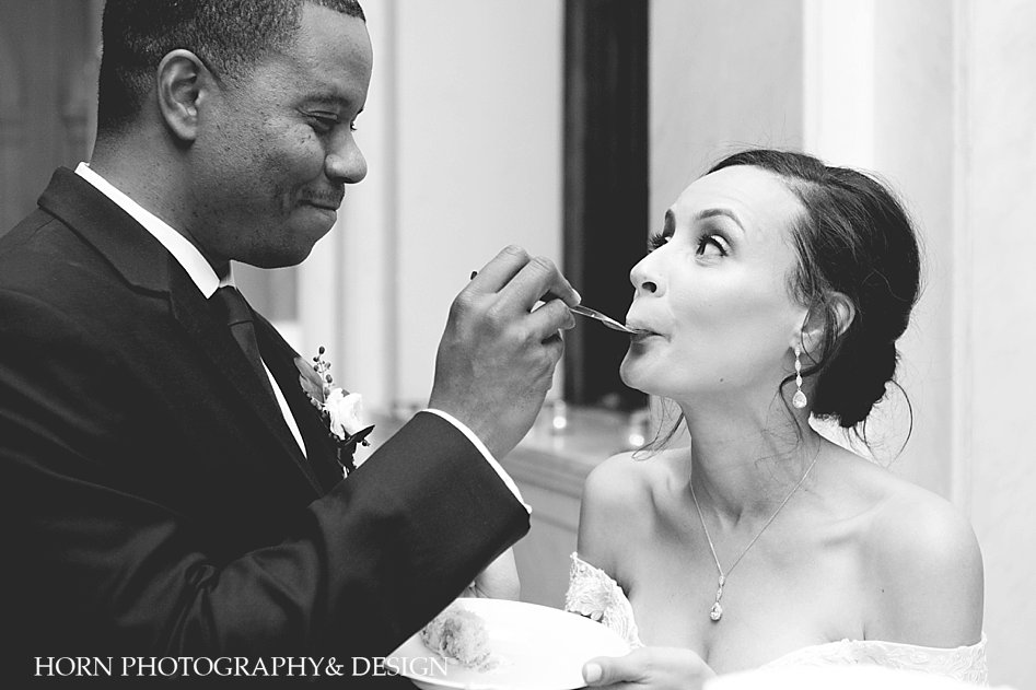 Cutting the cake at wedding Historic Dekalb Courthouse Wedding Black couple Atlanta Wedding Photographer Horn Photography and Design