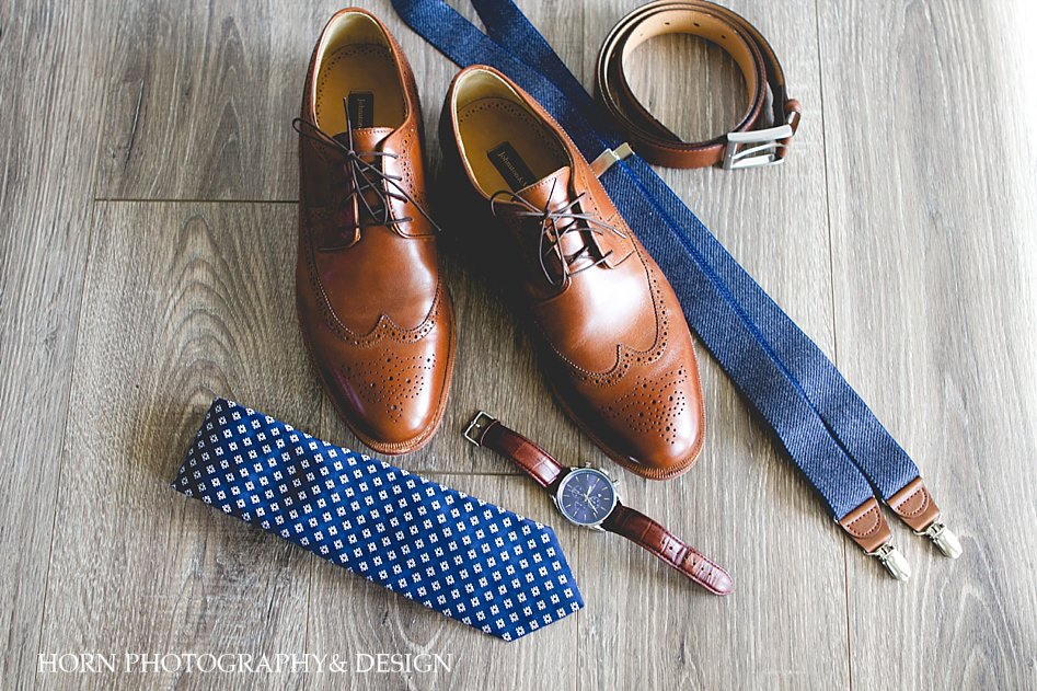 brown shoes blue suspenders brown belt