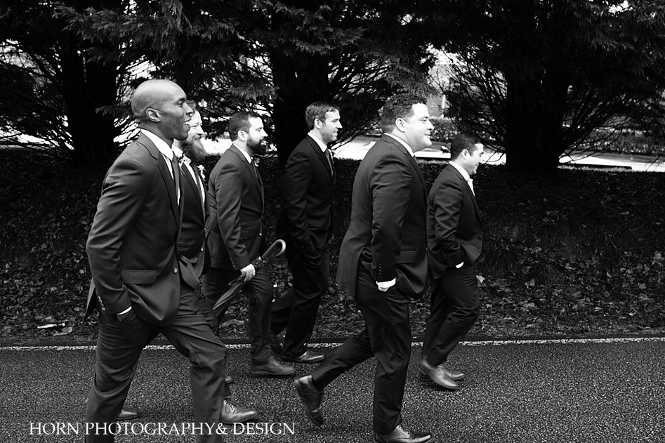 groomsmen walking up the street