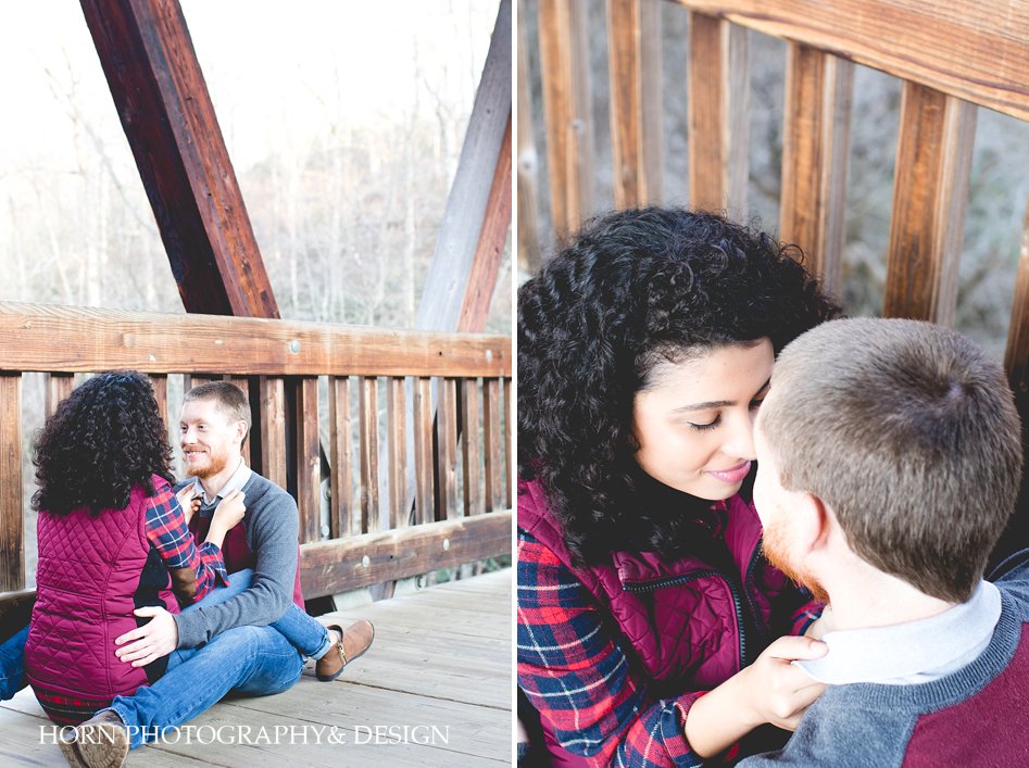 Roswell Waterfall Engagement couple sits on bridge horn photography and design