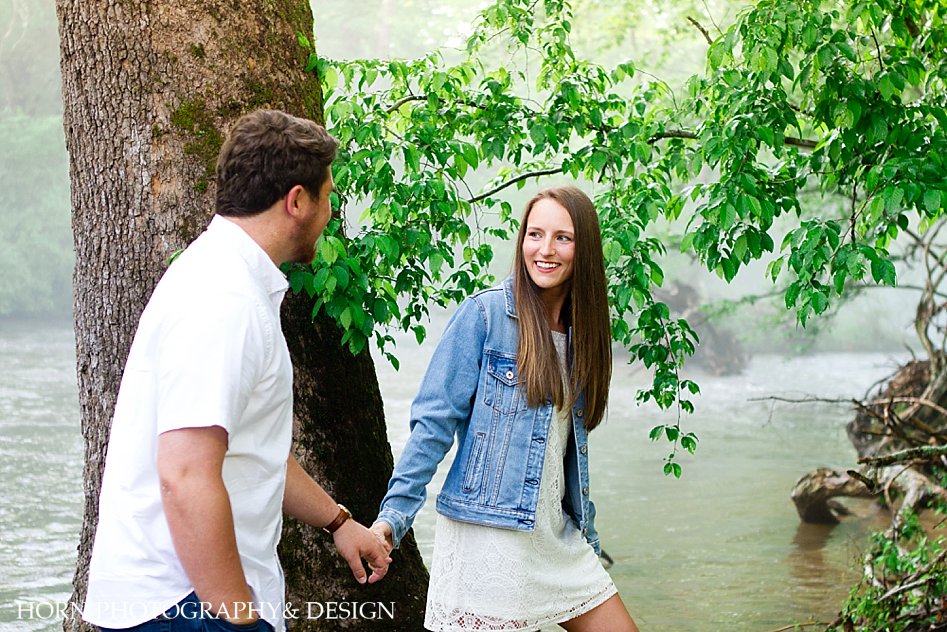 couple holding hands on engagement shoot