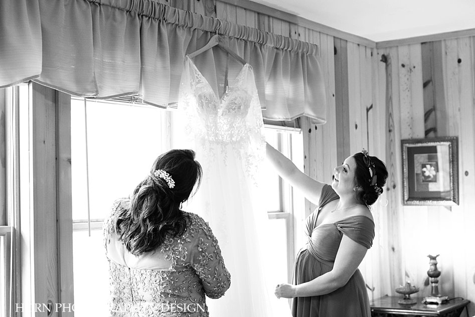 bride's mother views wedding dress black and white Hiawassee River wedding horn photography and design