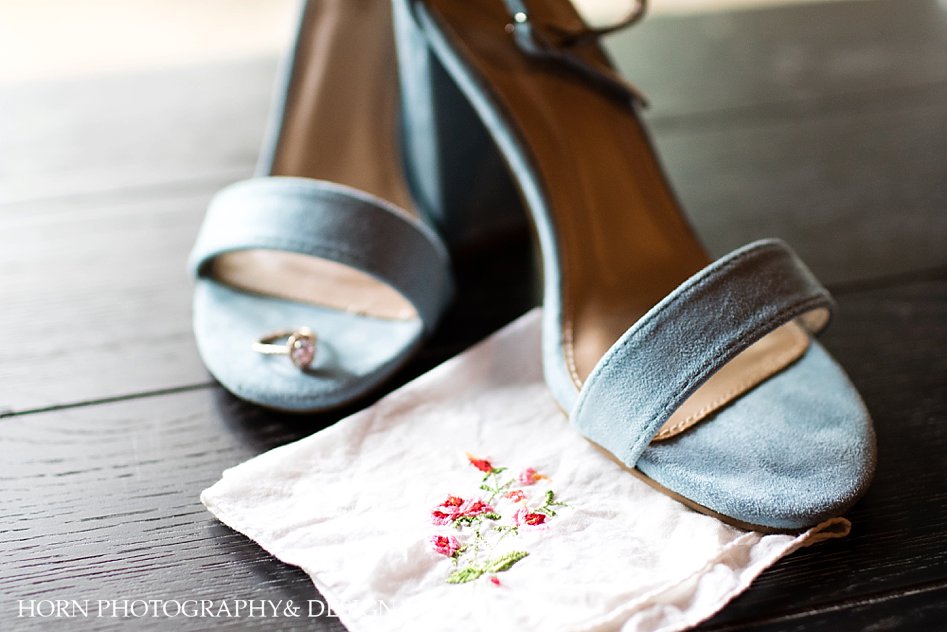 wedding shoes with engagement ring and handkerchief