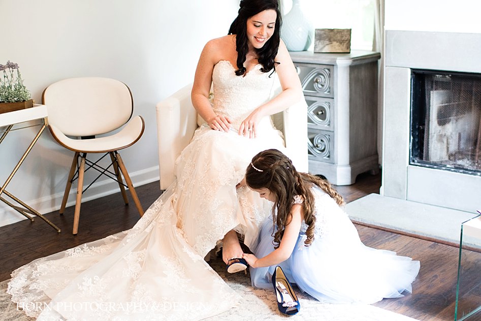bridal getting ready with flower girl emotional wedding horn photography and design Dahlonega photographers videographers photo film video 