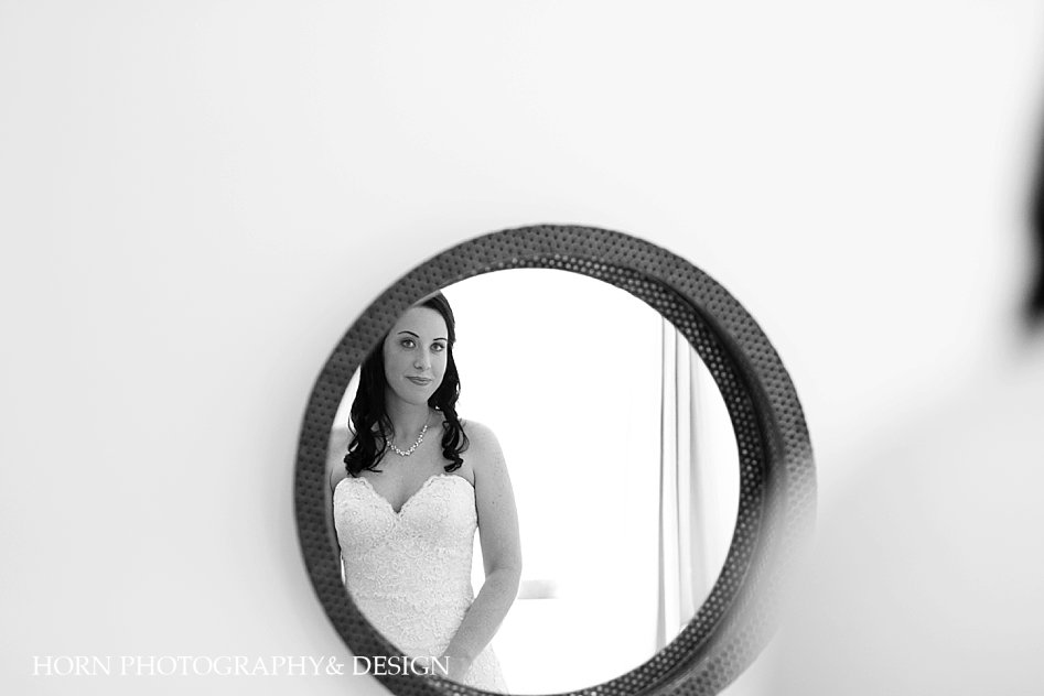 bride looking into mirror 